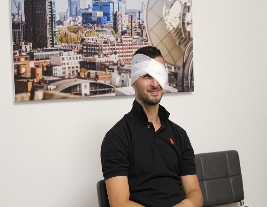 man with bandaged head