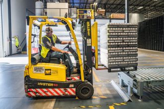 worker moving a forklift truck