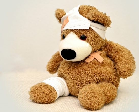 a bandaged teddy bear