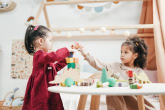 children playing with wooden blocks