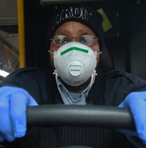 a woman driving a bus